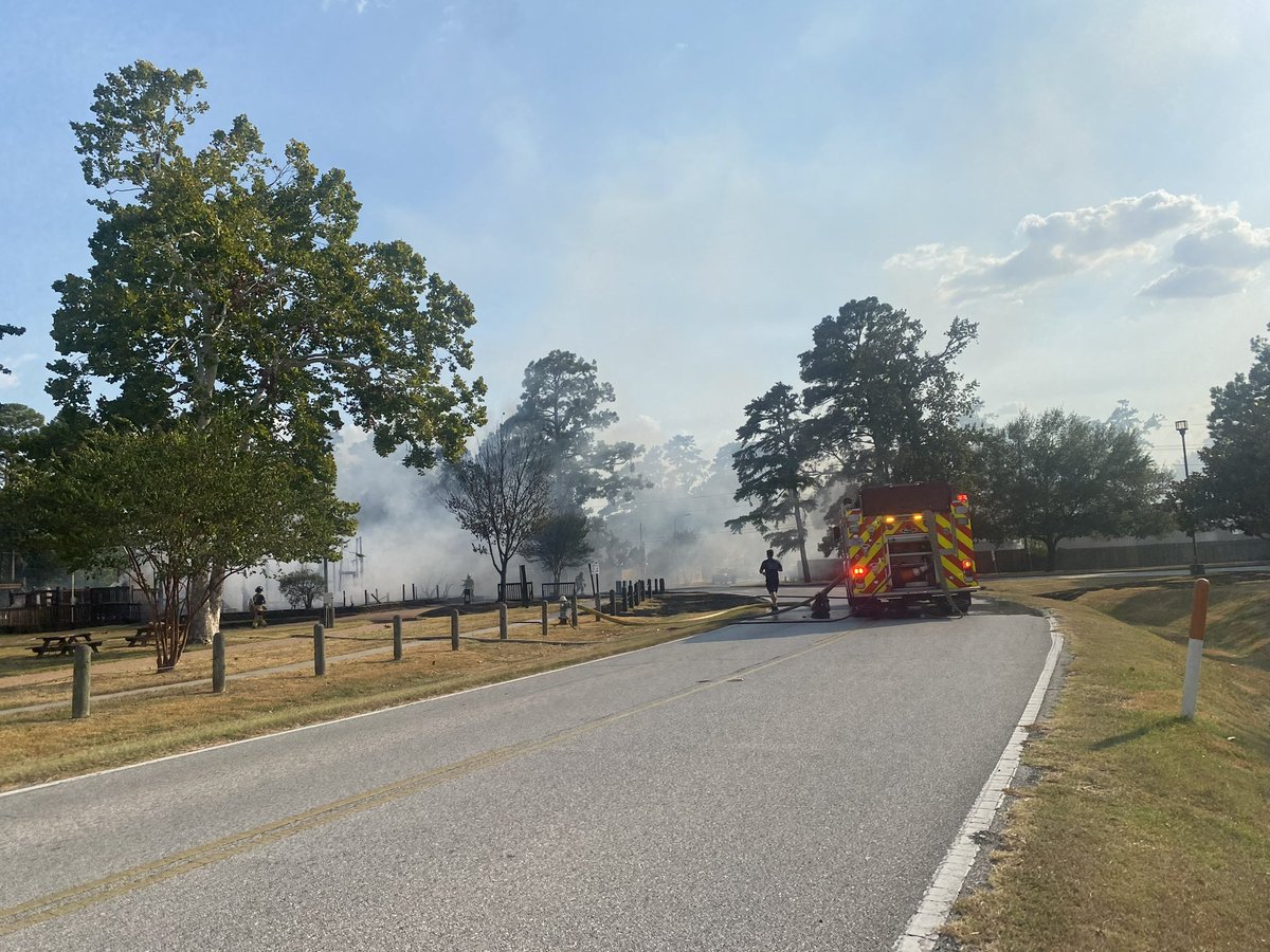 Pct4Constable's tweet photo. HAPPENING NOW! 

Constable Deputies and the Spring Fire Department are working a fire in the 2700 block of Trailing Vine. 

Further investigation revealed that unknown suspect(s) set fire to the grass and playground equipment. 

No injuries reported at this time. https://t.co/dC9cODyL4t