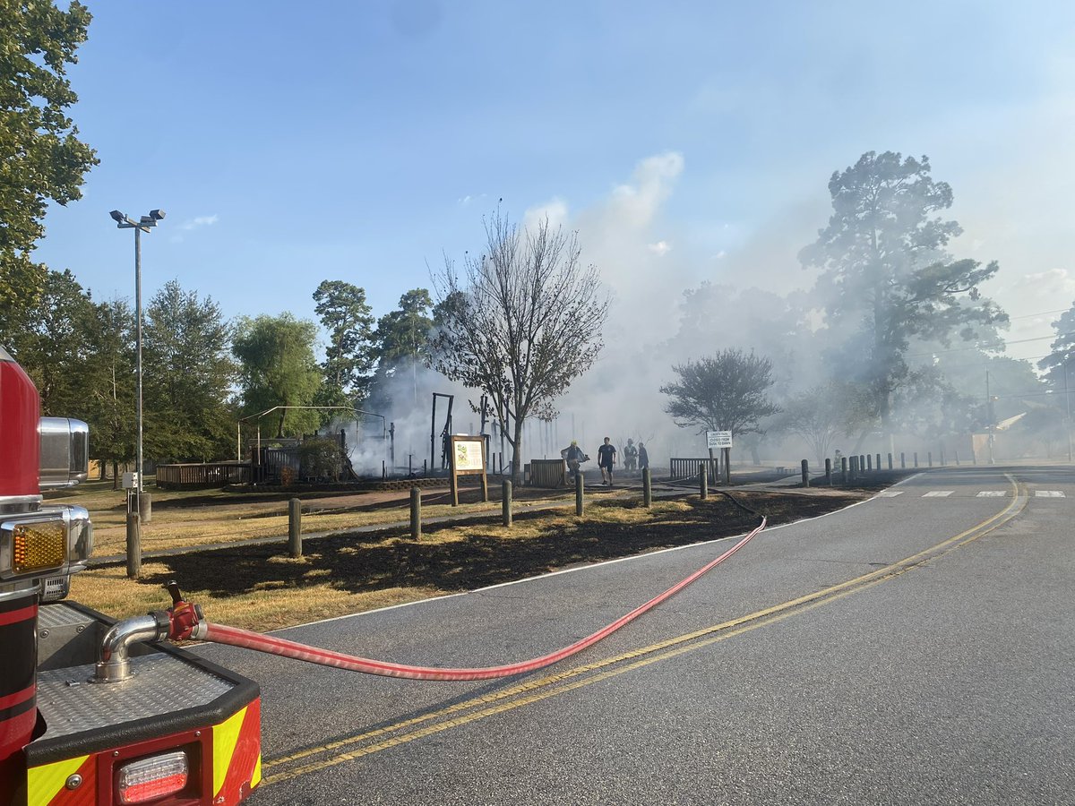 Pct4Constable's tweet photo. HAPPENING NOW! 

Constable Deputies and the Spring Fire Department are working a fire in the 2700 block of Trailing Vine. 

Further investigation revealed that unknown suspect(s) set fire to the grass and playground equipment. 

No injuries reported at this time. https://t.co/dC9cODyL4t