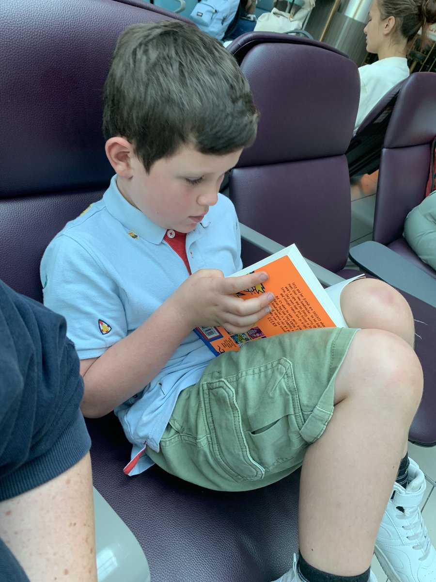 A delay at Gatwick can only mean one thing: emergency trip to the book store! He chose “My Head Teacher is a Vampire Rat” by <a href="/Pamela_Butchart/">Pamela Butchart</a> (sorry <a href="/HT_Coughlin/">HTinGuernsey🇬🇬</a> ) and he was so engrossed he actually complained when the gate number eventually came up and he had to move 😂