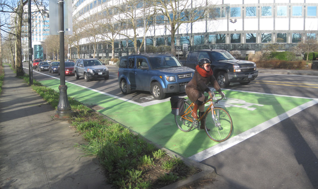 jen_keesmaat's tweet photo. Friend on the weekend asked what the big green boxes at intersections are for - they are 'bike boxes'.

#Guelph has created this handy graphic: bike boxes clarify who belongs where in the road right-of-way. 

The big idea is that by getting cyclists out in front of the cars at an intersection, they have visibility, and drivers can see where cyclists are and what they are doing. 

#SafeCity