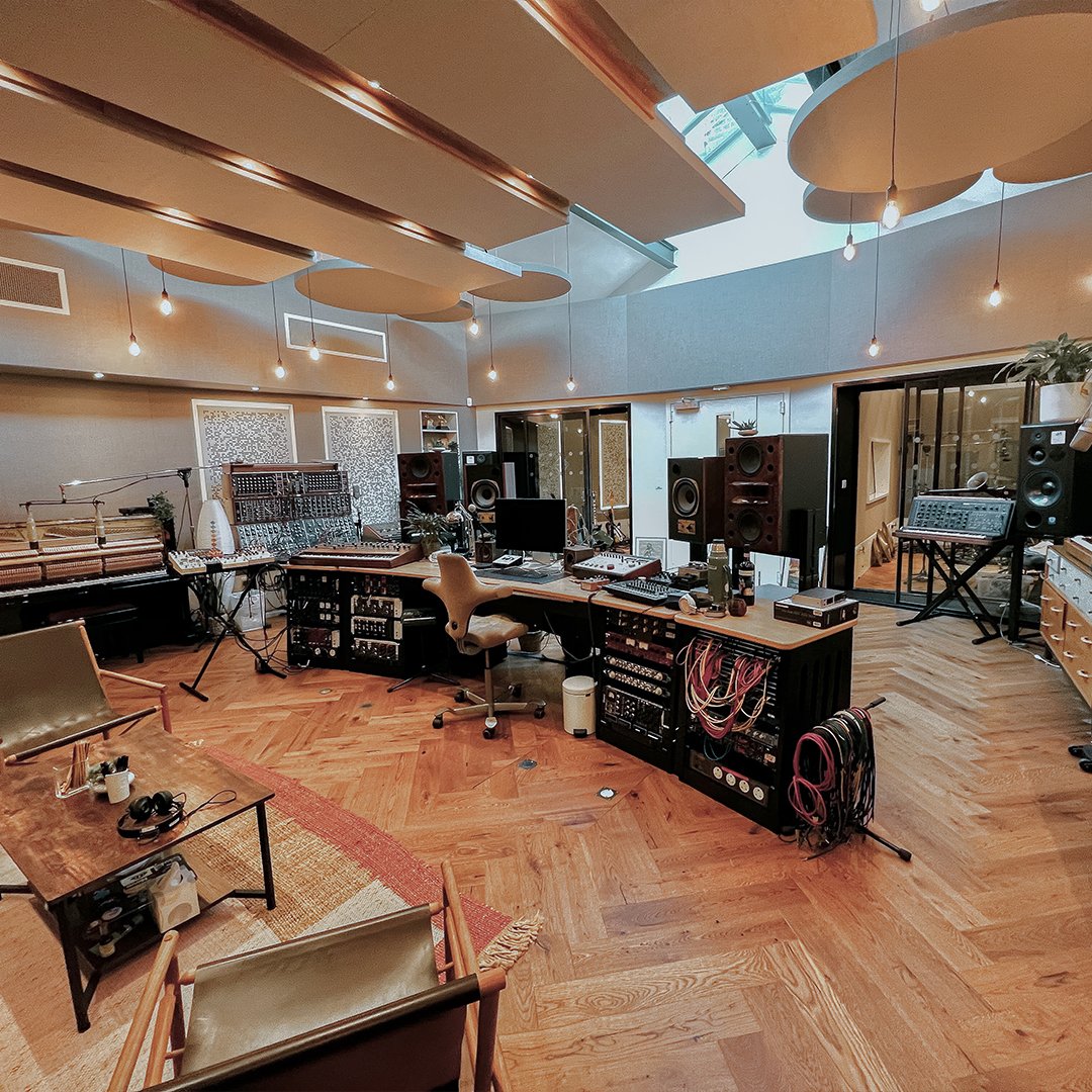milocostudios's tweet photo. Another inspiring studio finished by the Miloco Builds team, this one for legendary band Coldplay. 

Producer Dan Green initially got in touch in early 2021 to discuss some renovations to their Beehive studio, a large space the band had been using for writing but with very basic treatment and a floor that needed replacing. They wanted to create some booths, but keep the main space as a huge creative control room. Once the initial strip out had begun, it was clear that to properly float a new concrete slab some extensive building work would be needed, so the brief grew substantially.

What we’ve achieved speaks for itself. The natural light and cantilevered treatment is reminiscent of the scheme at The Church, although the warm tones in the flooring and fabric give the space a homely feel with a nod to the futuristic. The audio install was completed by our team with absolutely zero compromises - point to point and with the best pres to be found anywhere.

Throughout the rest of the building a similar design philosophy meant opening out smaller rooms, moving the bathrooms and storage to the basement to create a second studio on the second floor with views across London. It’s a studio designed by engineers for engineers, and we are very proud to be part of this milestone in the band’s history. 

Of the project, Dan says: 
“Miloco have been a pleasure to work with and were able to complete the project to a very tight deadline. There was great communication throughout, from the acoustic design, connectivity to the lighting and everything in between they have had the greatest attention to detail… Pete and the team have created and delivered the most inspiring creative space that I have ever worked in.”

Start your build today by emailing hello@milocobuilds.com