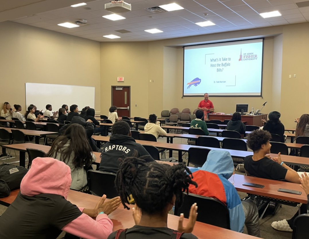 Mr_ARod's tweet photo. Dr. Harrison, Associate Dean of SJFU School of Business and Director of @BuffaloBills Training Camp Operations, discussed the planning processes of hosting the Bills and career opportunities in sports with @RCSDNYS students over the course of 3 days. @FisherNews #AccelerationU https://t.co/UsWUqgfvU2