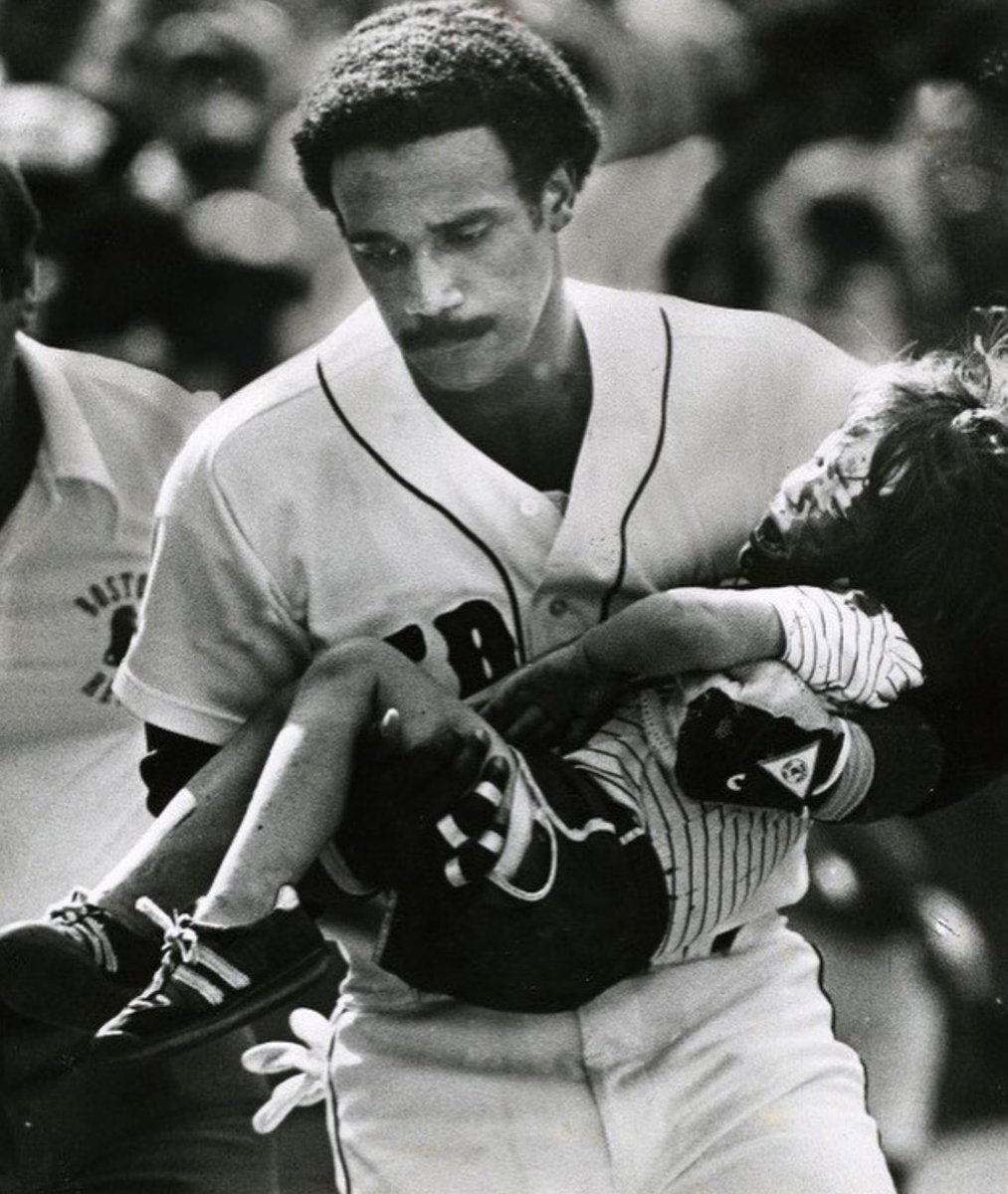 AfricanArchives's tweet image. On this day  in 1982,  a line drive foul ball hits a four year old boy, Jonathan Keane, in the head at Fenway Park. Jim Rice, realizing in a flash that it would take EMTs too long to arrive and cut through the crowd, sprang from the dugout and scooped up the boy, saving his life.