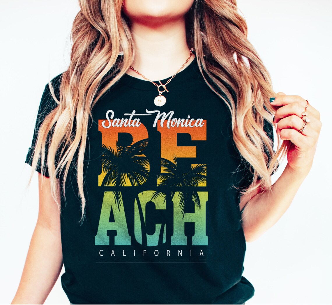 designcryptgift's tweet photo. ☀️ California Dreamin' at Santa Monica Beach! 🌊🌴 Sun and surf in style with our Santa Monica Beach California Shirt! 🏄‍♀️🌅

https://t.co/ItwguJ93of

#shirtstyle #tshirtlovers #californiadreaming #californiacoast #beachvibes #beachday #beachwear #beachfashion https://t.co/nehRrfGyhv