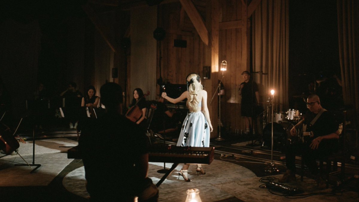 Ariana Grande is currently trending worldwide on X, following new photos with an orchestra.