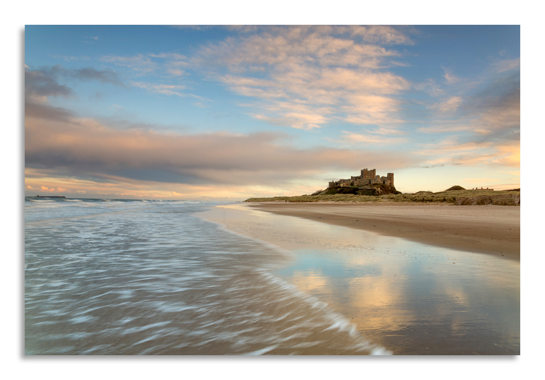 Things to love about Northumberland - we've got more castles than you can shake a big stick at! The lovely Bamburgh Castle at sunset, with an outgoing tide for a bit of swooshery and some pretty sunset-sky reflections.