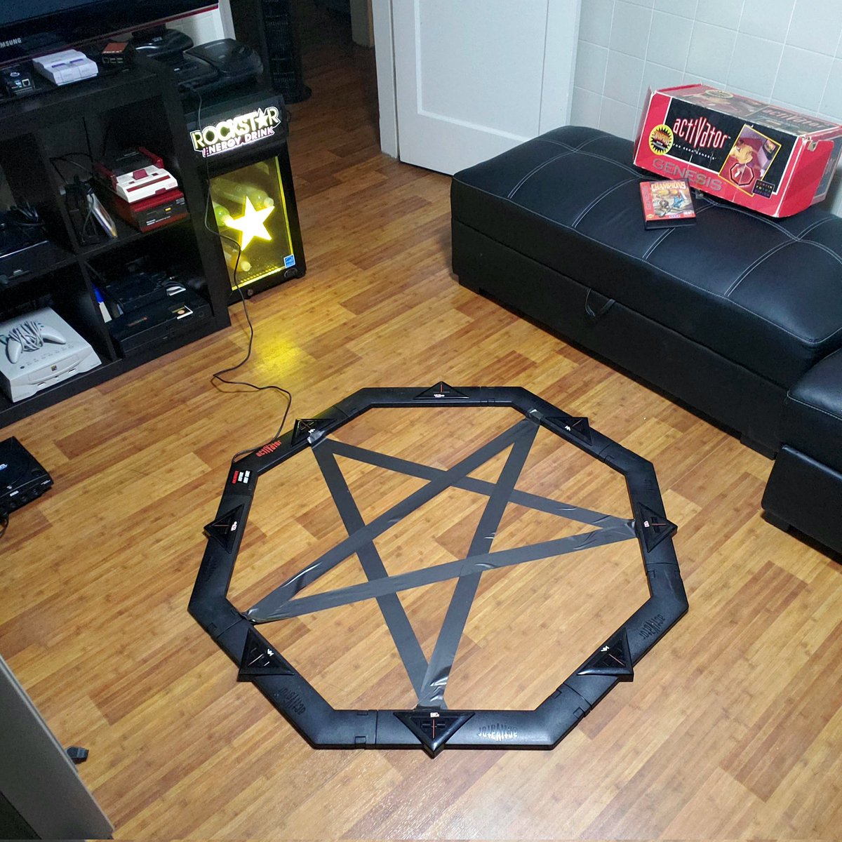 I decided to set up my Sega Activator for the Genesis last night.
It's this octagon you assemble and your movements are translated into button input for the games.

But I decided I didn't want it sliding around on me, so I taped it down...

#sega #retro