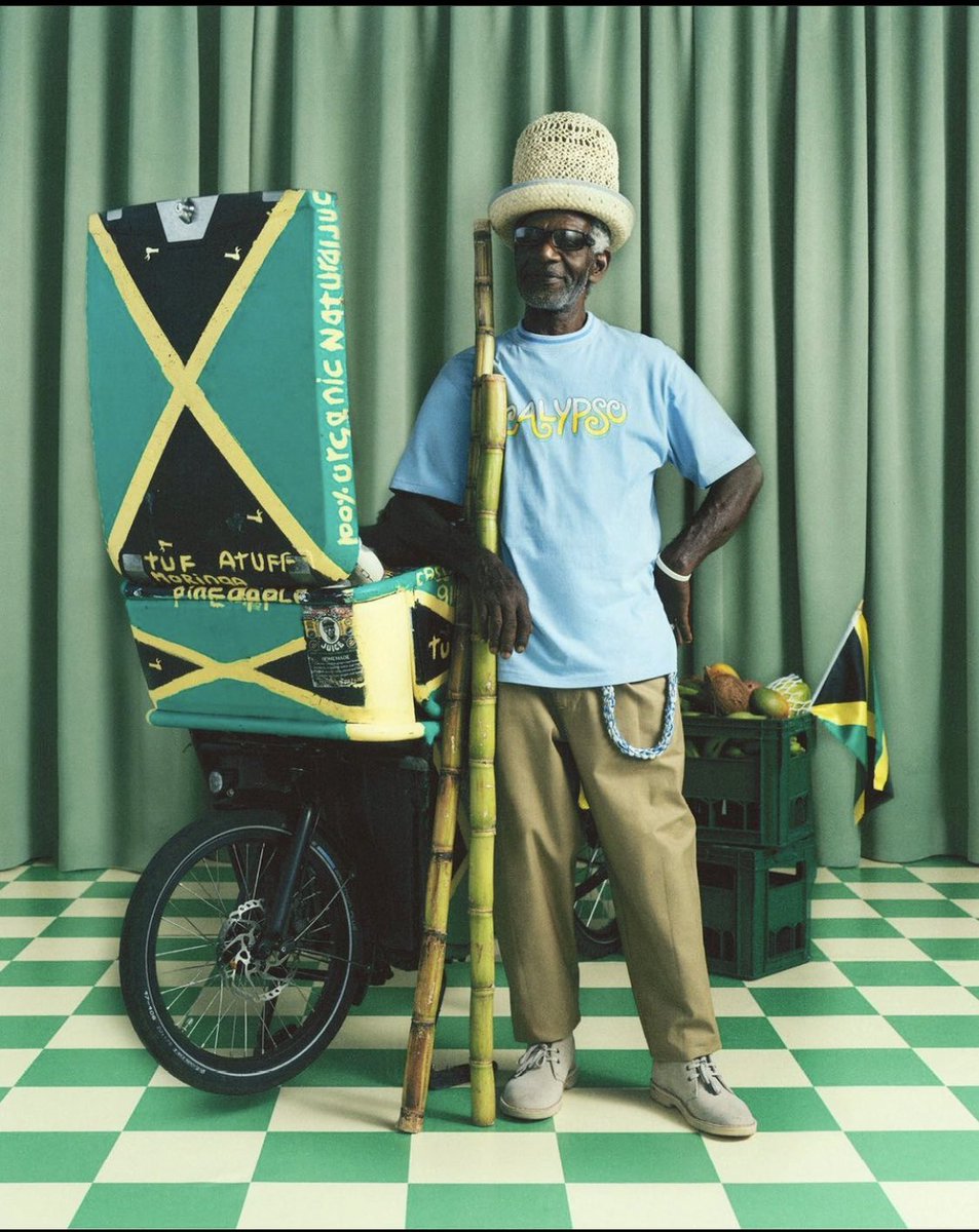 rootsdeh's tweet photo. Scottish/Jamaican designer @nicholas_daley_ presents SS23 Calypso T-Shirt, in collaboration with London based artist Kione Grandison and hand-made straw Panama crown hat in collaboration with @uptownyardieUK 

Modelled by Adolphus (Tufa Tuff), a Hackney juice serving legend! https://t.co/pk4bEFUaEH