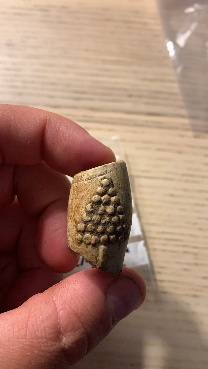 EddieCStewart's tweet photo. We’ve had another great day on site with exciting finds including a 18th c. decorated pipe bowl and the rim of a possible 16th or 17th c. face jug(?). Deturfing continues and a beautiful slab floor is emerging inside our structure! #ScotlandDigs2023 #Glencoe2023 https://t.co/mNqxEj7S5Q