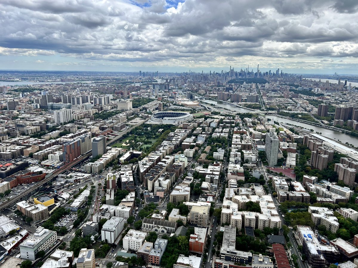 ChopperDanRice's tweet photo. The Bronx looking back at Manhattan.  There is so much going on in this picture…@yankeestadium, the old Bronx County Courthouse, East &amp; Harlem Rivers, Central Park, the Skyline &amp; a busy sky with a tiny piece of blue peeking through! I ❤️ my job!@CBSNewYork #chopper2 @FlyHeliInc https://t.co/b9jgim11iz