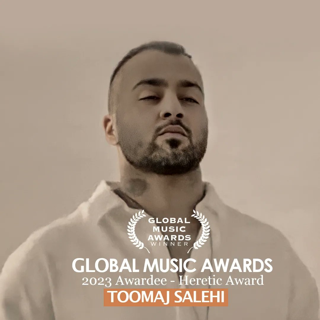 OfficialToomaj's tweet photo. توماج صالحی مفتخر به دریافت جایزه «هرتیک» از Global Music Awards شد.

«گلوبال موزیک اواردز» در بخش موسیقی اعتراضی، جایزه جهانی خود با نام «هرتیک» را در سال ۲۰۲۳ به #توماج_صالحی اهدا کرد.
قطعه موسیقی «فال» توسط این سازمان معتبر قابل توجه قرار گرفت و سبب شد که جایزه سالانه ویژه خود را بنام توماج صالحی ثبت کند. 
گلوبال موزیک اواردز در صفحه رسمی خود اعلام کرد: « سازمان جوایز جهانی موسیقی از توماج صالحی، خواننده رپ ایرانی، با دریافت جایزه هرتیک برای موسیقی اعتراضی برای قطعه موسیقی «فال»  تقدیر می‌کند. توماج صالحی که صدای این اعتراضات شده بود، پس از انتشار این موزیک بازداشت، شکنجه و به ۶ سال و ۳ ماه زندان محکوم شد و همچنان از رسیدگی پزشکی محروم می‌باشد. همه ما می‌توانیم به دلاوری و اراده قاطع توماج صالحی امیدوار باشیم. ما مفتخریم که می‌توانیم چنین مرد باورنکردنی را بشناسیم و امیدواریم که از حبس ناعادلانه‌اش رهایی یابد.»
توماج صالحی اولین هنرمندی‌ست که توانسته جایزه جهانی موسیقی در بخش اعتراضی را بطور ویژه دریافت کند.
#FreeToomaj
منبع:
https://t.co/VyW38HtYUi