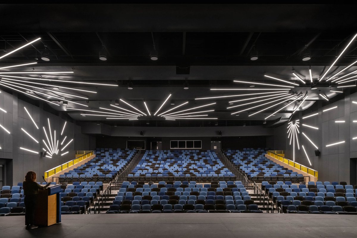 foundryservice's tweet photo. Crenshaw High School Auditorium in Los Angeles, CA with AFC Stone (formerly Patina) Flint #fibercement boards. These panels were cut into the "starburst" shape to match the lighting and glued onto the wall. Architect: @NACLosAngeles  
https://t.co/6oDOY0b42X https://t.co/cFV3DMLYKG