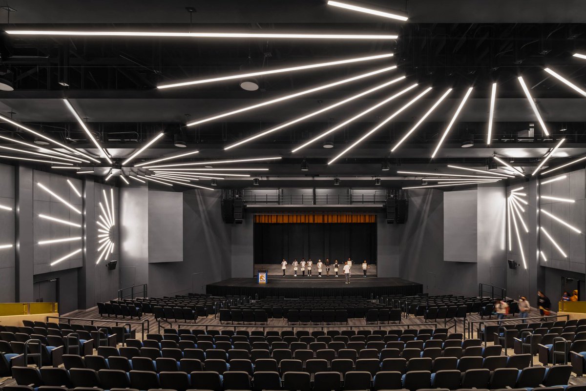 foundryservice's tweet photo. Crenshaw High School Auditorium in Los Angeles, CA with AFC Stone (formerly Patina) Flint #fibercement boards. These panels were cut into the "starburst" shape to match the lighting and glued onto the wall. Architect: @NACLosAngeles  
https://t.co/6oDOY0b42X https://t.co/cFV3DMLYKG
