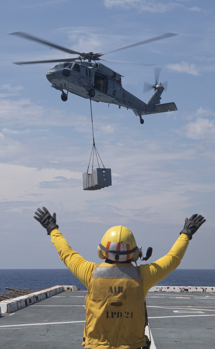 USNavy's tweet photo. Staying supplied and READY all around the 🌏
Navy Aviation Boatswain’s Mate Petty Officer 3rd Class Shamus Fraser guides a MH-60R during a Vertical Replenishment aboard #USSNewYork currently participating in #LSE2023 a joint exercise with @USMC Aug 9-18, across 22 time zones. https://t.co/zTBtzN1mvV
