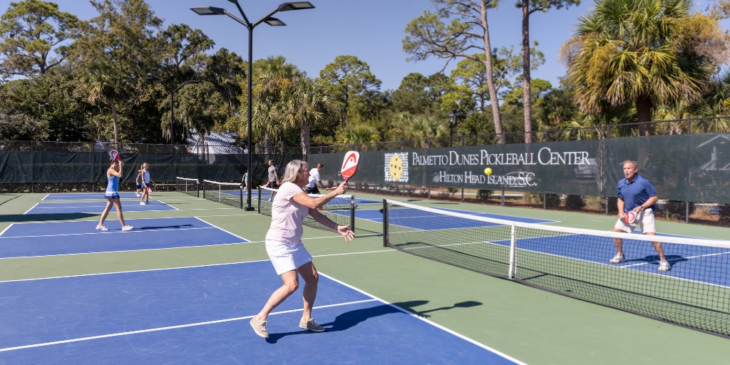 hiltonheadsc's tweet photo. Happy National Pickleball Day! 🏓 🎉 

Did you know that there are over 100 courts on Hilton Head Island? This includes several public courts such as the Sea Pines Racquet Club, Palmetto Dunes Pickleball Center, and the Port Royal Racquet Club! https://t.co/6YUcHLXh3c