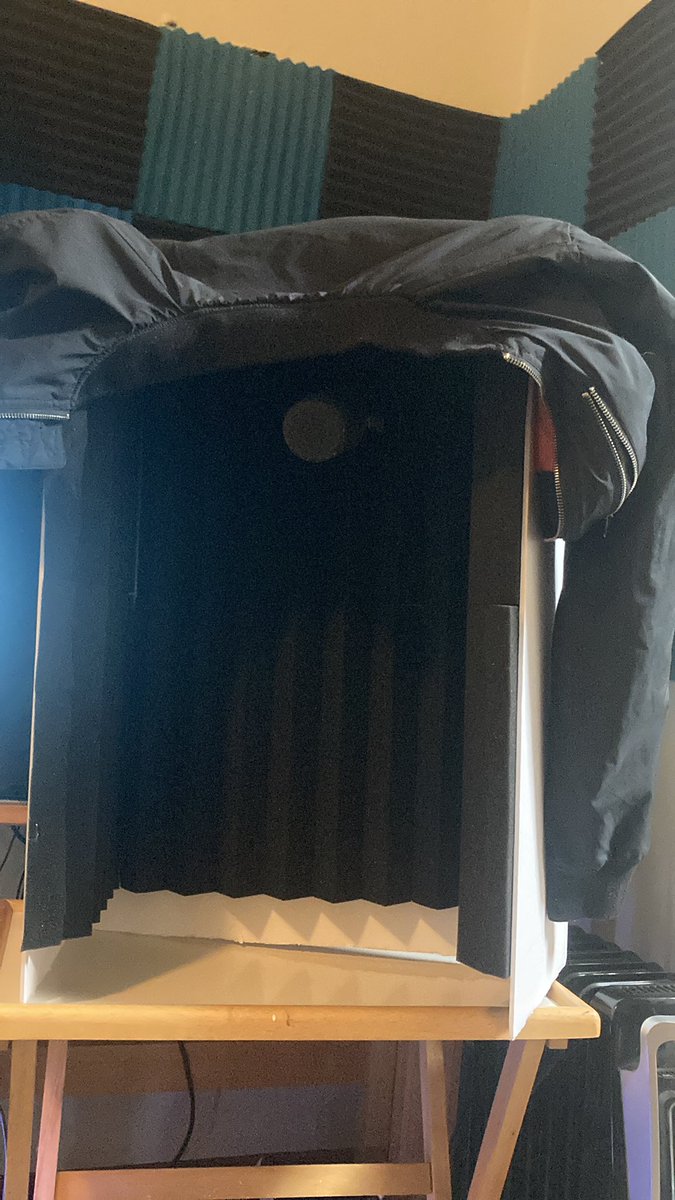 CynththeK's tweet photo. Behold: The world’s most scuffed microphone isolation shield set up.

Made with a fold-out poster board, spare acoustic foam, hot glue, and a dream. https://t.co/tU4OOFJbBc
