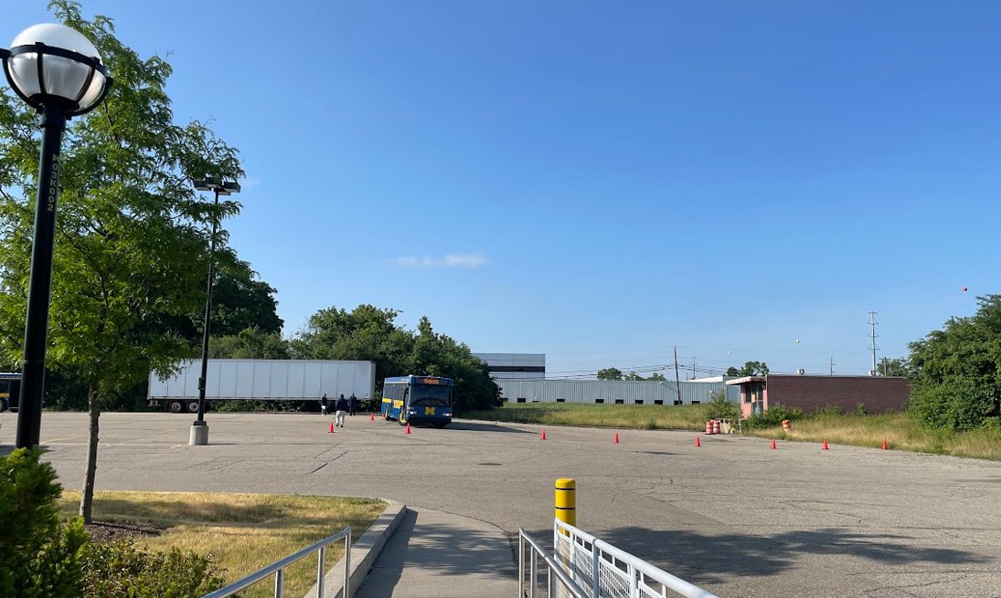 PaleoJB's tweet photo. Highlighting an inconsistency at @UMich: Blue Bus drivers receive training at Lot SC43, a yellow lot 4.5 mi S of campus. Yet, bus transportation isn't facilitated for @UmichLSA building occupants. Let's bridge this gap for a more inclusive campus community. 🚌 #UMich https://t.co/CrLm0lN7VZ