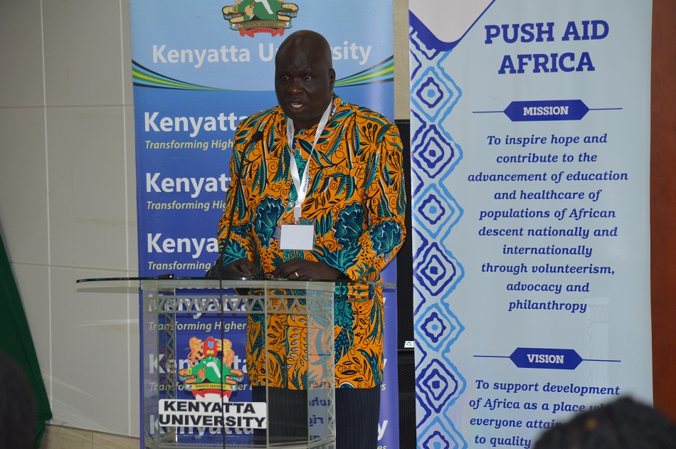 Dr. Geoffrey Anguyo, Board Member, Push Aid Africa (PAAF) and Executive Director, Kigezi Health Care Foundation, Uganda, gives his opening remarks during the opening of the 6th Annual Africa Interdisciplinary Health Conference Theme: Mitigating Pandemics, Climate Change & Chronic…