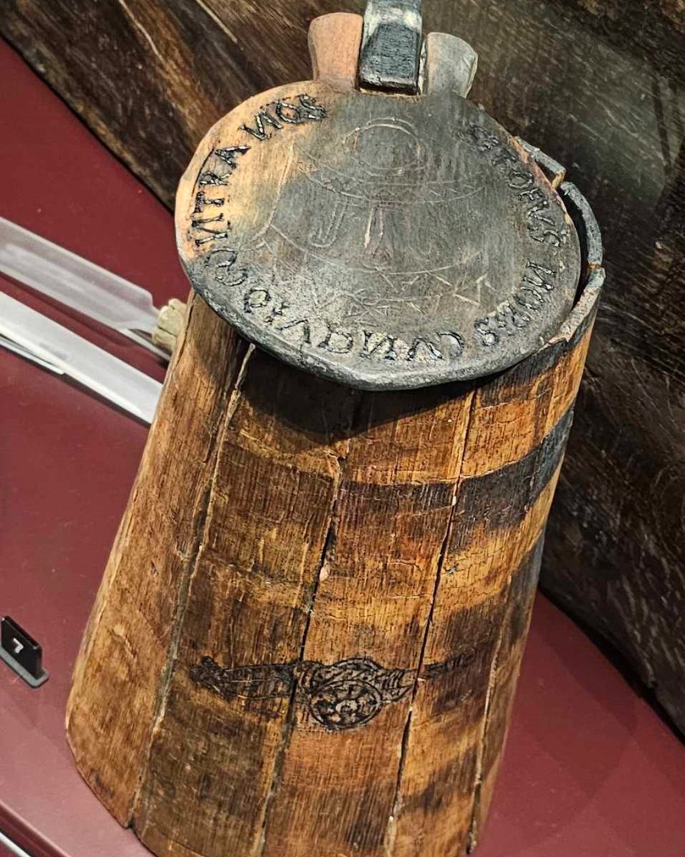 MaryRoseMuseum's tweet photo. "#MyFavouriteArtefact is this gallon #flagon found aboard the Mary Rose. The image of the bronze gun on the side - likely etched by a gunner in their free time - wouldโve been a familiar sight for all who shared the daily allowance of #beer..." https://t.co/GlCrdZXERJ