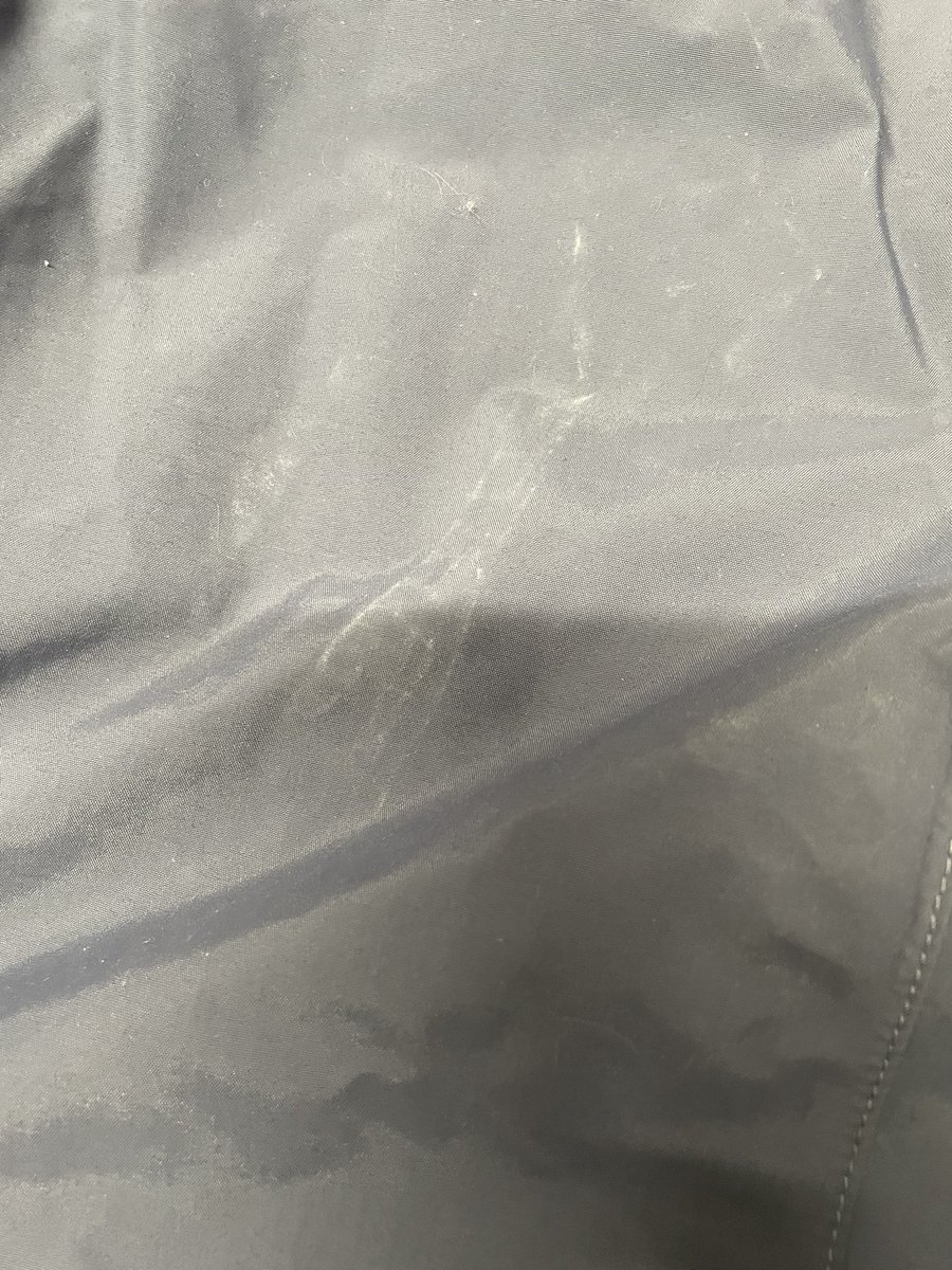 Tjpixy's tweet photo. This is my waterproof jacket @RiversideUK that your contractor stood on leaving dirty marks all over it and then hung it on the door. Nice. #badcontractor #badworkmanship https://t.co/DwxLyPXv6J
