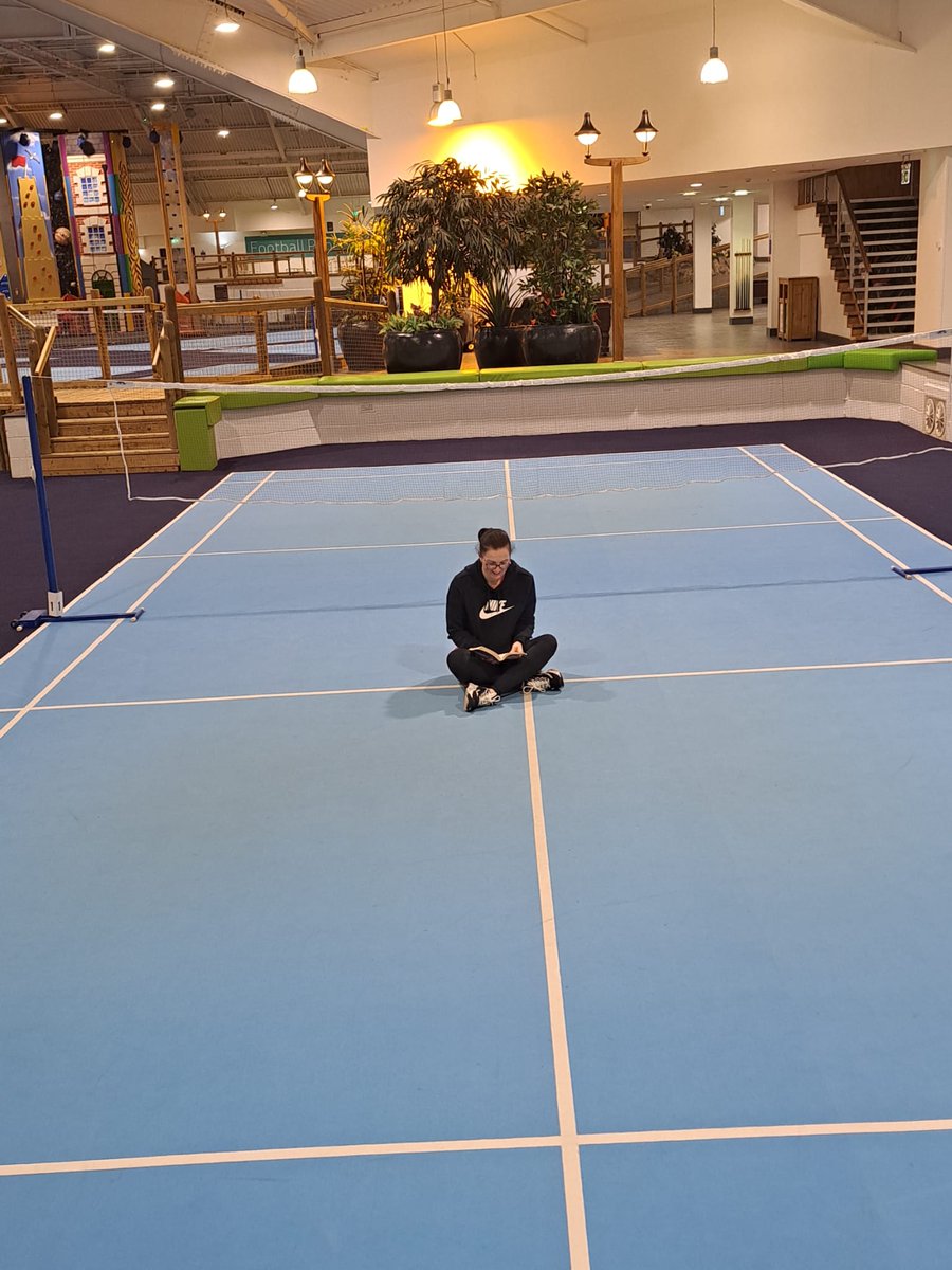 jemburton's tweet photo. @SandwichJunior Mrs Burton reading somewhere sporty, she even managed to find a quiet spot in the middle of a Badminton court! 🏸📖
#summerreadingchallenge https://t.co/GlMFOJbSI1