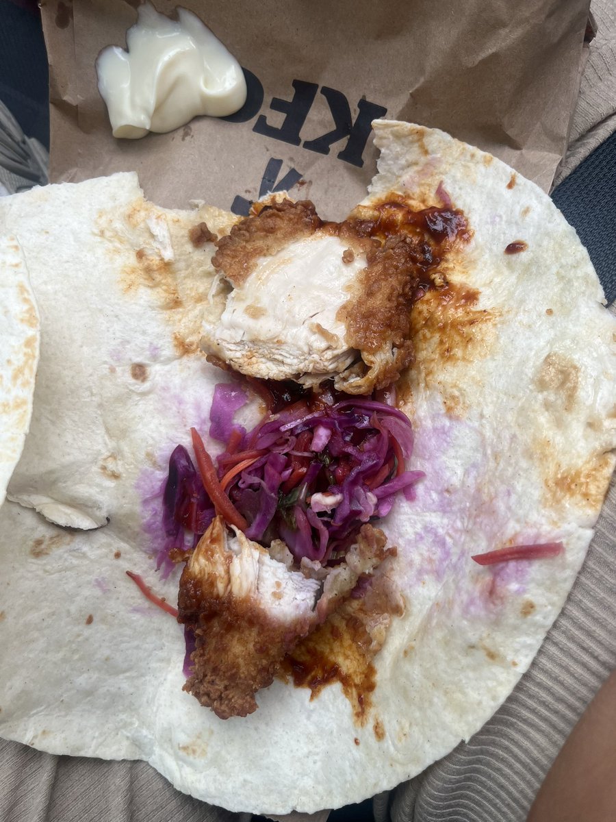 TiaTaylor12's tweet photo. @kfc I’m sorry but what is that?

One piece of chicken ripped in two (clearly by hand) and the middle of my wrap filled with only coleslaw 

Where’s the rest of the chicken? https://t.co/Uf57YLydHT