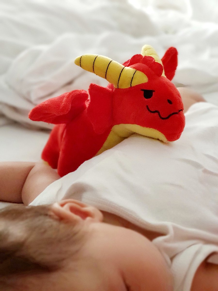 Most babies have teddy bears other animals as their first stuffed or plush toy. My baby has a Dungeons & Dragons Red Dragon. 😄 future #dungeonmaster? 🤔 #dungeonsanddragons #DnD #reddragon #plushtoy