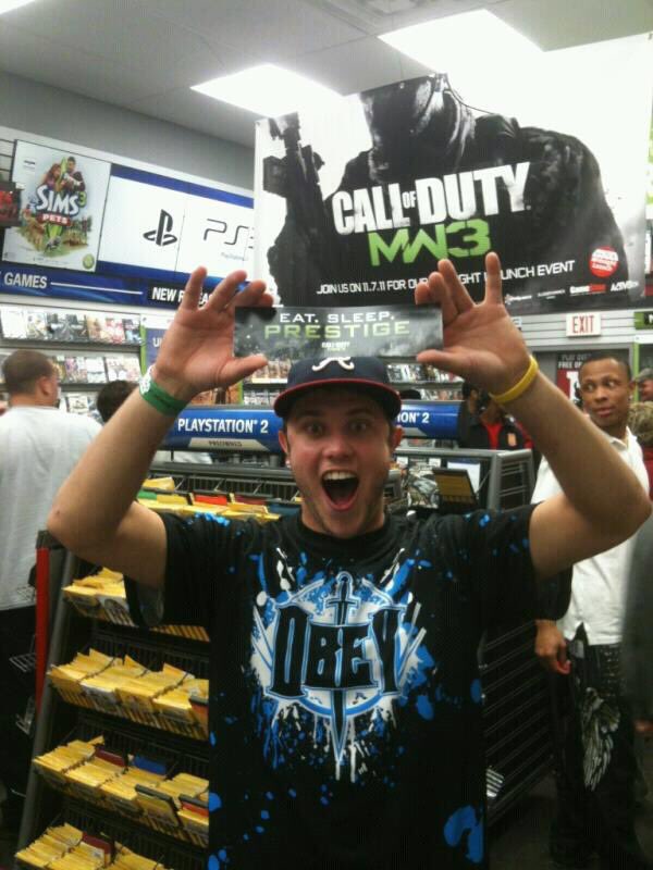 DexBadgett's tweet photo. Might have to recreate this photo during the release of  #MWIII 

So much nostalgia here: 
• Taken at GameStop
• PlayStation 2/3 logos in the background
• Call of Duty #MW3  banner above me
• Obey jersey
• Livestrong bracelet

A throwback, for sure. https://t.co/dJlrJe1IrW