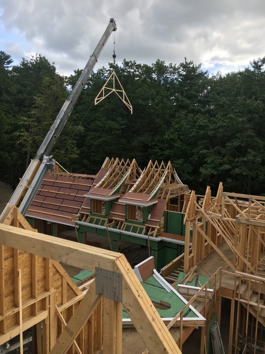 JPCHomebuilder's tweet photo. We’re setting the trusses to provide the structural framework for this new custom home. We love the balance and symmetry. 

ZIP System sheathing will protect the home from water and air intrusion. 
🔨 @HuberWood

#Architecture #Trusses #ZipSystem #Sheathing #MichiganMade [1/2] https://t.co/dbsXcaGXL7