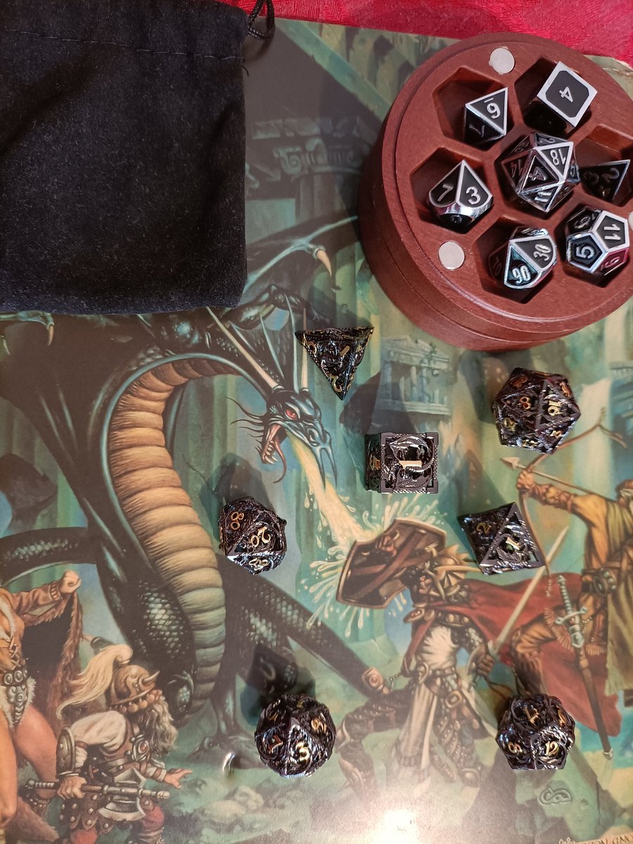 kaisnowshadow's tweet photo. #RPGaDay2023 Favourite Dice. As a general rule not keen on metal dice they're just so heavy and take chunks out of tables, etc., when rolled. I'll gladly make an exception here. Amy gave me the set in the wood tray and Paige gave me the front set. I have to choose these right? https://t.co/4118FrE4Ec