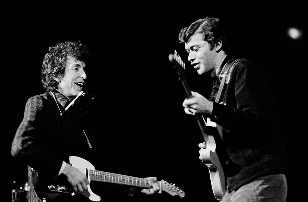 Bob Dylan performs with Robbie Robertson, Berkeley Community Theater, 1965. RIP Robbie 💔 📸: Jim Marshall. #BobDylan #Dylan #RobbieRobertson