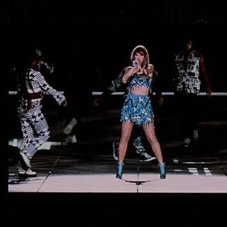 Taylor Swift debuts blue outfit for ‘1989’ at the Eras Tour.