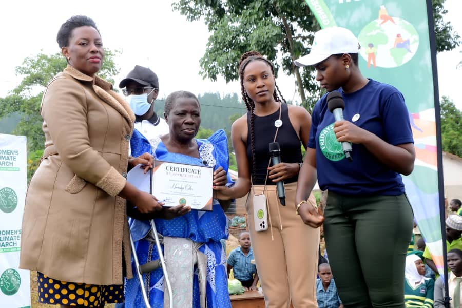 Fridays4FutureU's tweet photo. Last week we hosted a #womensclimatemarch and recognized an  80 year old environmental defender. Ms,
 Esther Nanvubya dedicated her life to fighting for our environment. She has inspired many generations. She is among the many unsung heroes. https://t.co/F9kKzE2ynk
