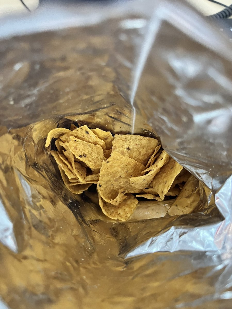 sas082's tweet photo. Is this some kind of joke @Doritos it’s not even half full there’s no way that’s 70g of crisps! Do better, very disappointed! https://t.co/g3J0EQwCF3
