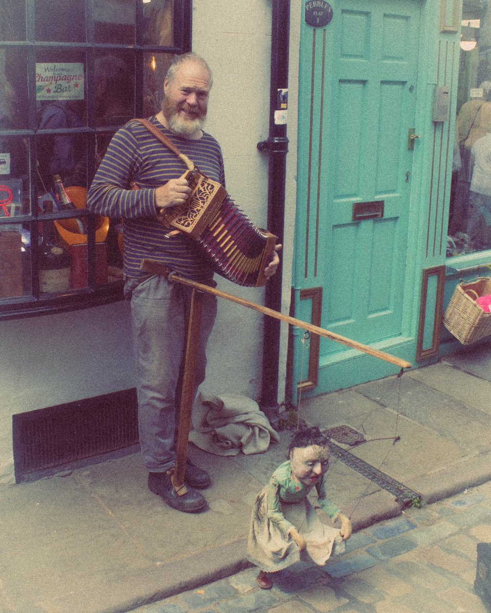 BlackRavenPhoto's tweet photo. Puppet man. I tried to make this look like an old photo. Not quite sure I managed it but I like the look anyway. #FullLength #People #Standing #puppeteer #street #opticalwander #curtispadley #shotoncanon #whitby #whitbypuppet #oldphoto https://t.co/g3RpOU01Es