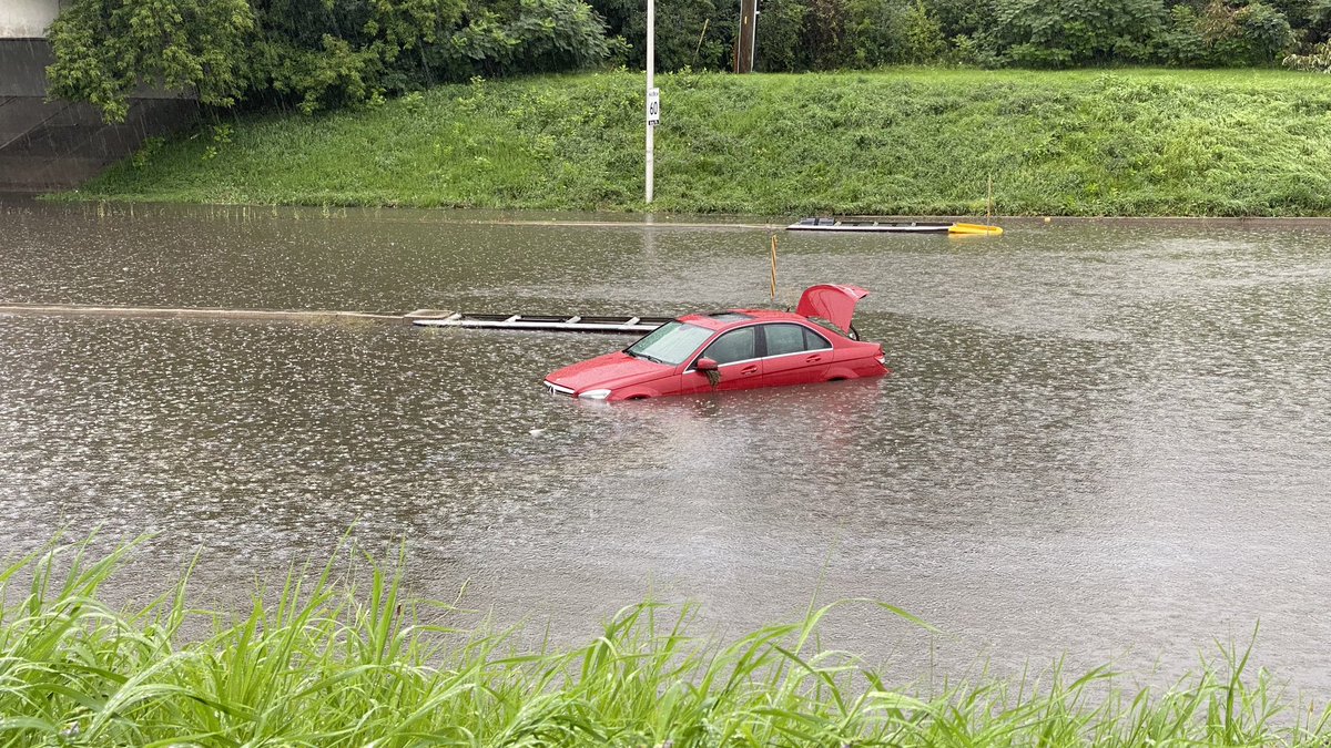 buntola's tweet photo. Flooding under the rail crossing on Woodroffe Ave. near Knoxdale area. #ottnews #ottawastorm #ottawa https://t.co/GyeTMxsnuk