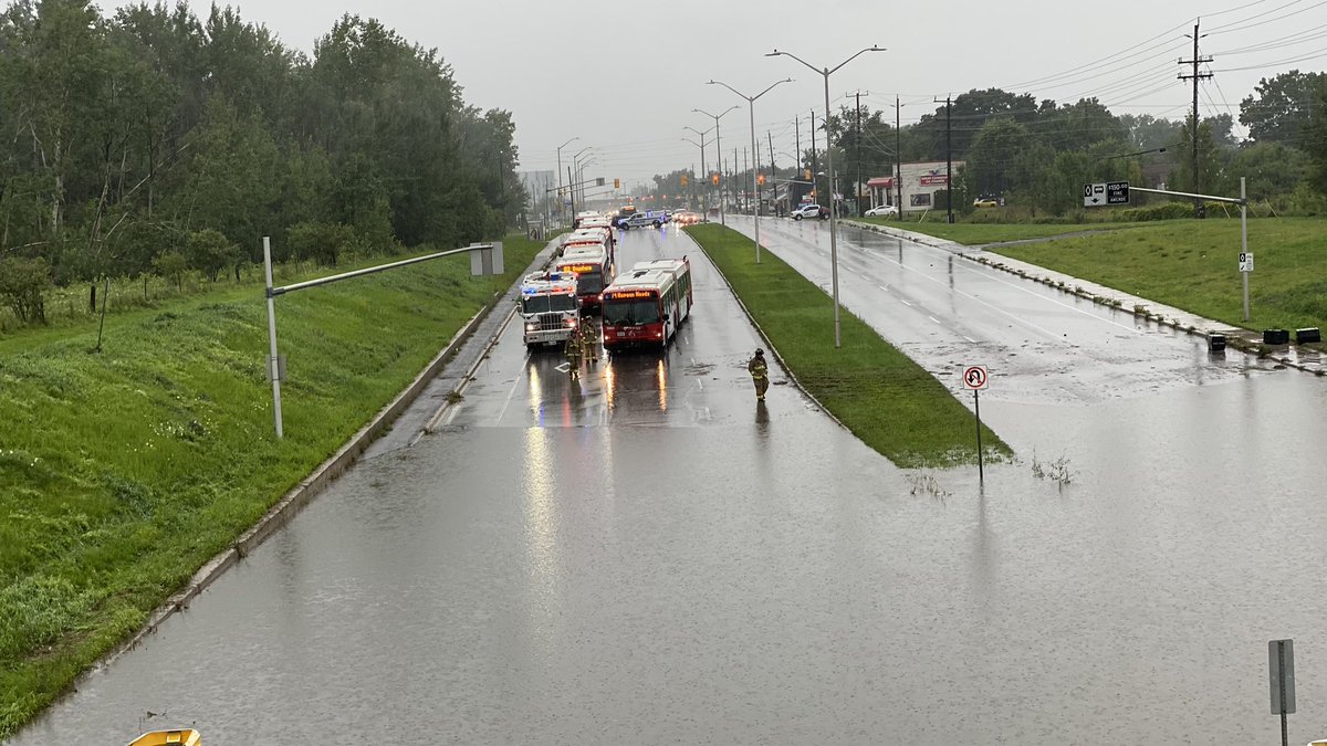 buntola's tweet photo. Flooding under the rail crossing on Woodroffe Ave. near Knoxdale area. #ottnews #ottawastorm #ottawa https://t.co/GyeTMxsnuk