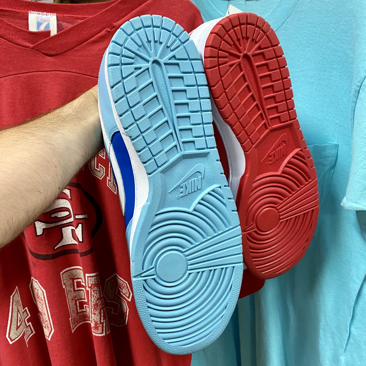 POV: You're in the sneaker matrix. Which shoe will you choose, the red or the blue? #NikeDunk Low Championship Red #Nike Dunk Low Argon Blue both available in-store or online. #nikedunks #dunks #underratedshoes #shoeseller