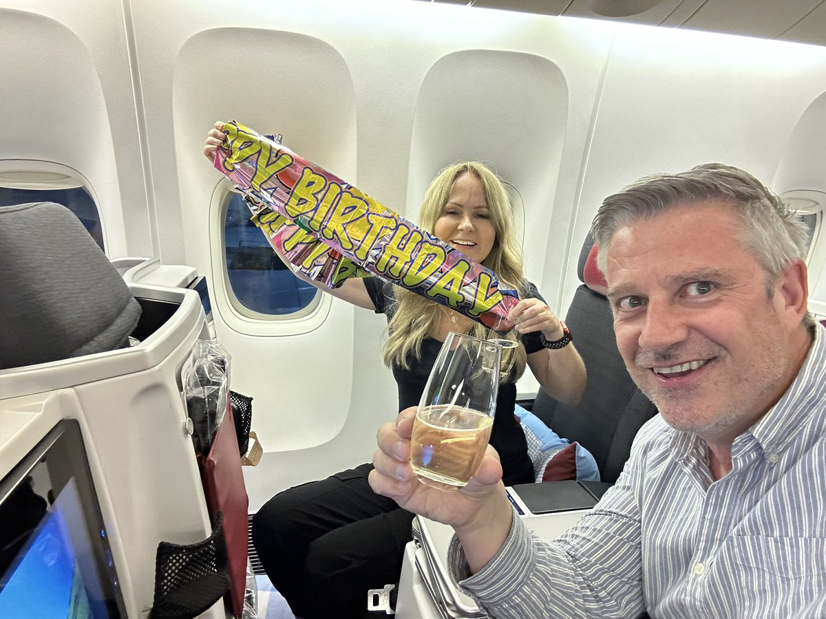 EmilyONeill1's tweet photo. If you’re gonna turn 50, you might as well do it drinking champagne in biz class on the way to Bangkok. Happy birthday @paulfishermusic ❤️❤️❤️ https://t.co/5Haw9Bz6cP