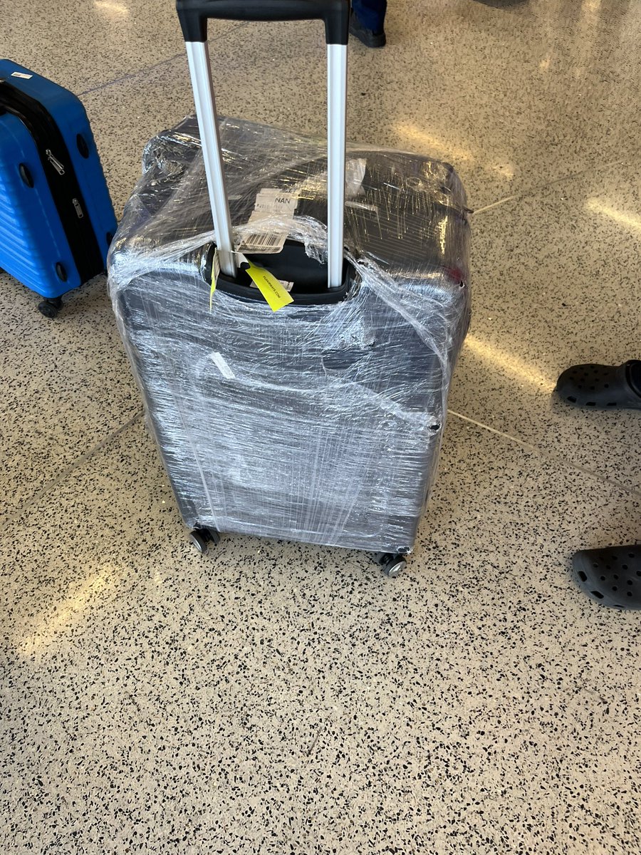 RobMo73's tweet photo. @FijiAirways just got off flight from fiji to  lax and this is what my bag looks like. Had to try and tape it up better for our next flight. What is my next step to resolve this? https://t.co/CtovzpuNfc
