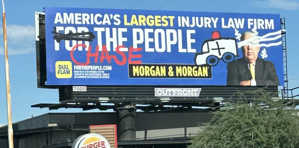 CaMcKnight's tweet photo. Is this massive billboard on eastbound Thomas near 40th st supposed to look like it was vandalized @ClueHeywood https://t.co/ahiOrSGfnm