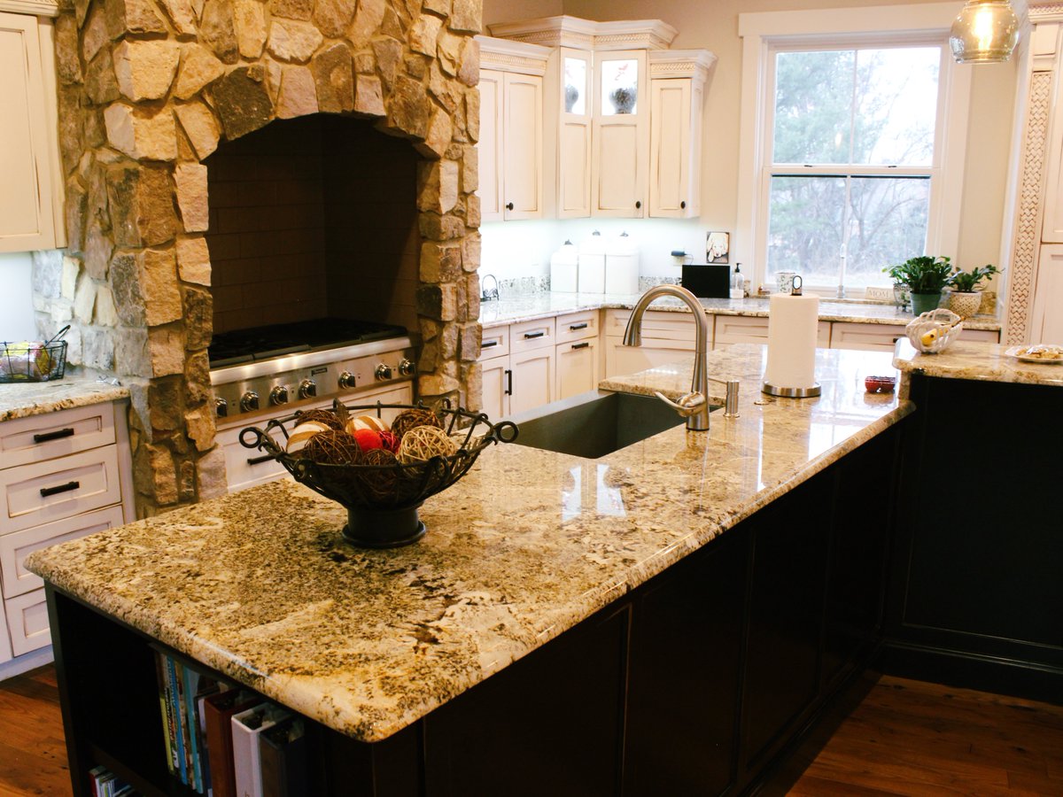 This favorite from eight(!) years ago showcases an incredible L-shaped shaped surface that perfectly complements the stunning cabinetry and hearth-style range.

Schedule a free consultation and take a step towards your next favorite memory 👉 premiergranite.com/contact-us