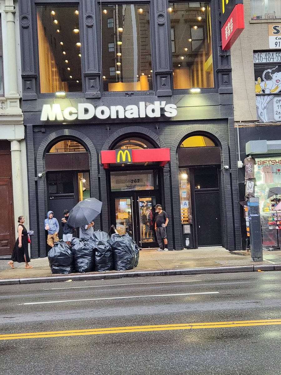 NYCSanitation's tweet photo. The black bags placed illegally outside the Canal Street @McDonalds tonight are a Happy Meal for RATS. We issued Ronald a warning - and he can read the rules at https://t.co/jaK3aBGuq3 before ticketing starts September 1. https://t.co/L6dqs9iOSH