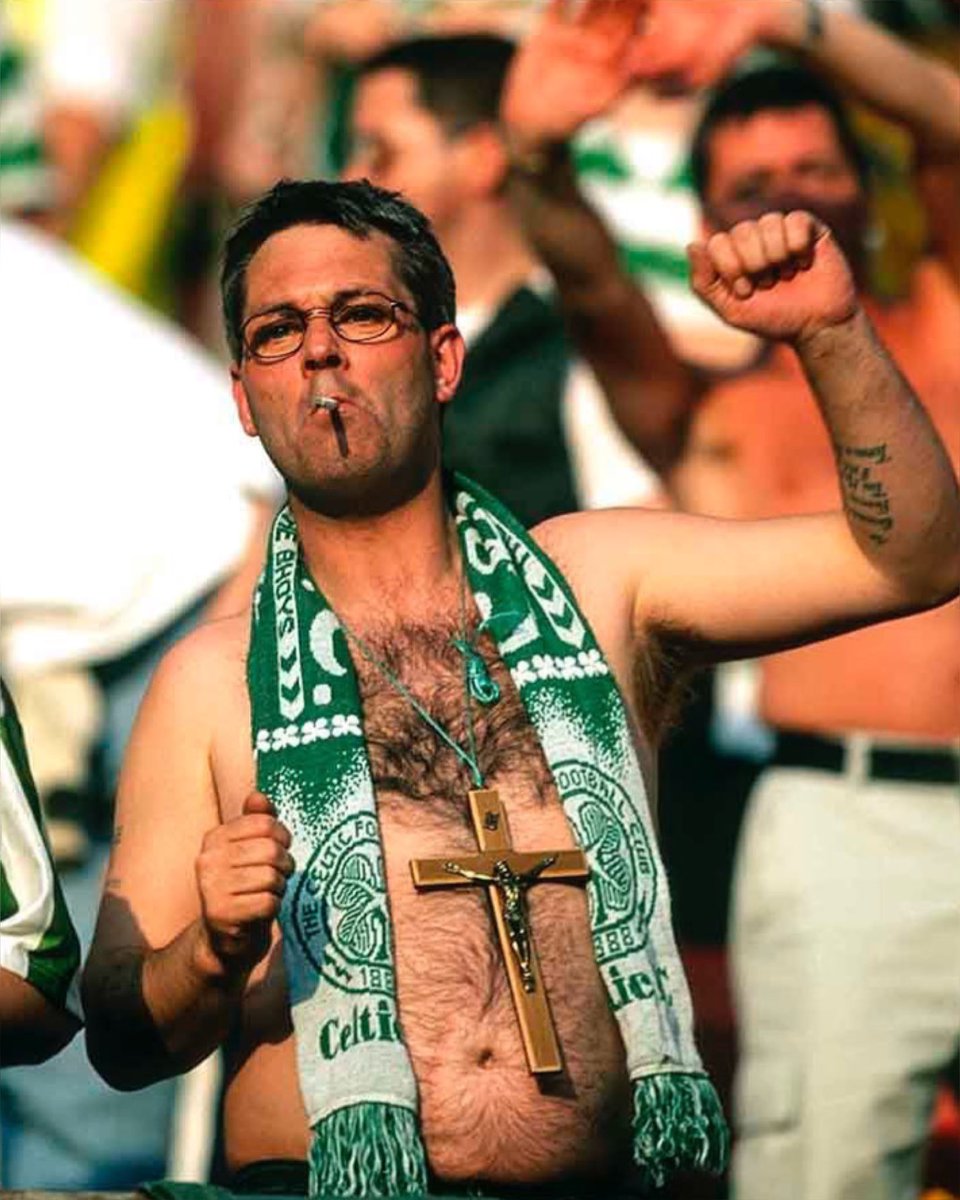 6. A Celtic fan and his massive cross, 2001, in a pre-season friendly against Manchester United.