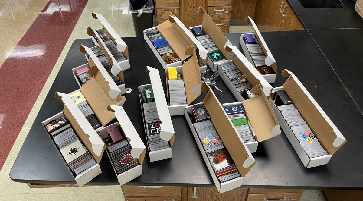 Would you have done better in school if getting good grades meant you got Magic cards?
Today I prepped these boxes full of goodies that kids will soon be earning from our “Game for Grades” prize wall.