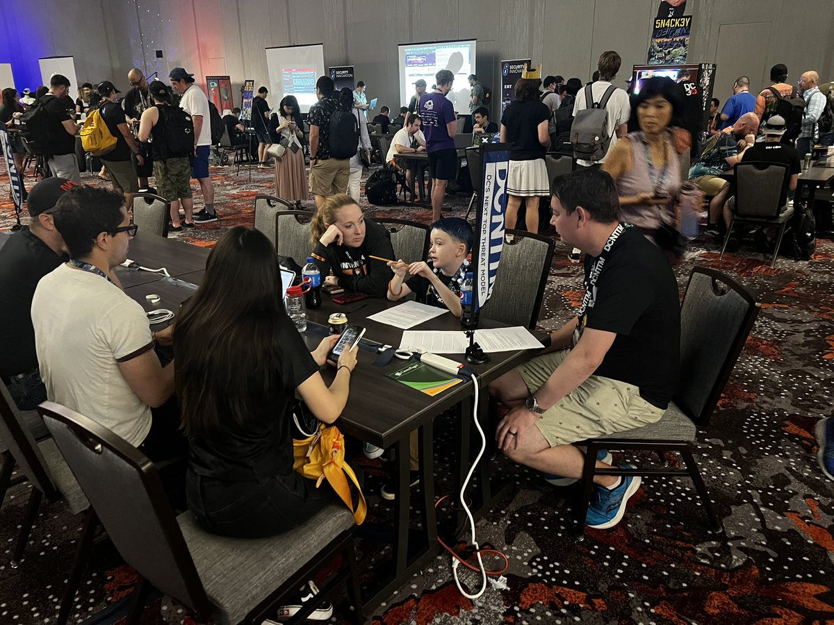 cparadis_'s tweet photo. @AppSecSeanner coaching a youngling about threat modeling. Warms the heart  #dcnttm #threatmoldeling #DEFCON31 https://t.co/9UNrM8Zqsg