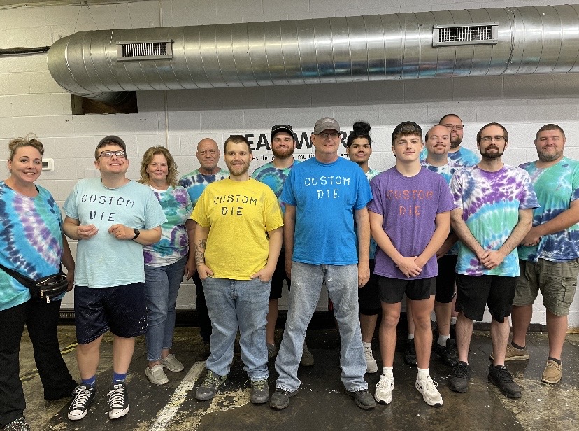 This team knows the power of inclusivity! Vista Employment Services client GS works at Custom Die Services Company and enjoys the family-like environment. Recently he made the whole team custom t-shirts! Thank you to Custom Die for embracing and supporting #autismemployment!
