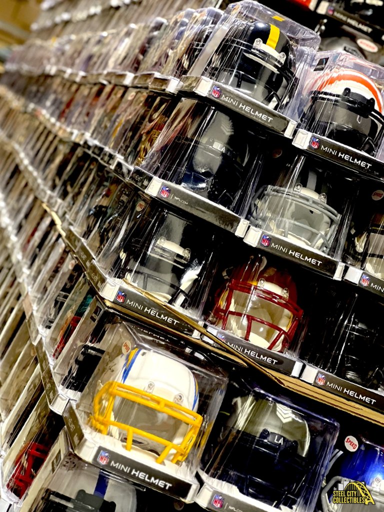 How many autographed mini helmets do you think are in this picture? 🤔