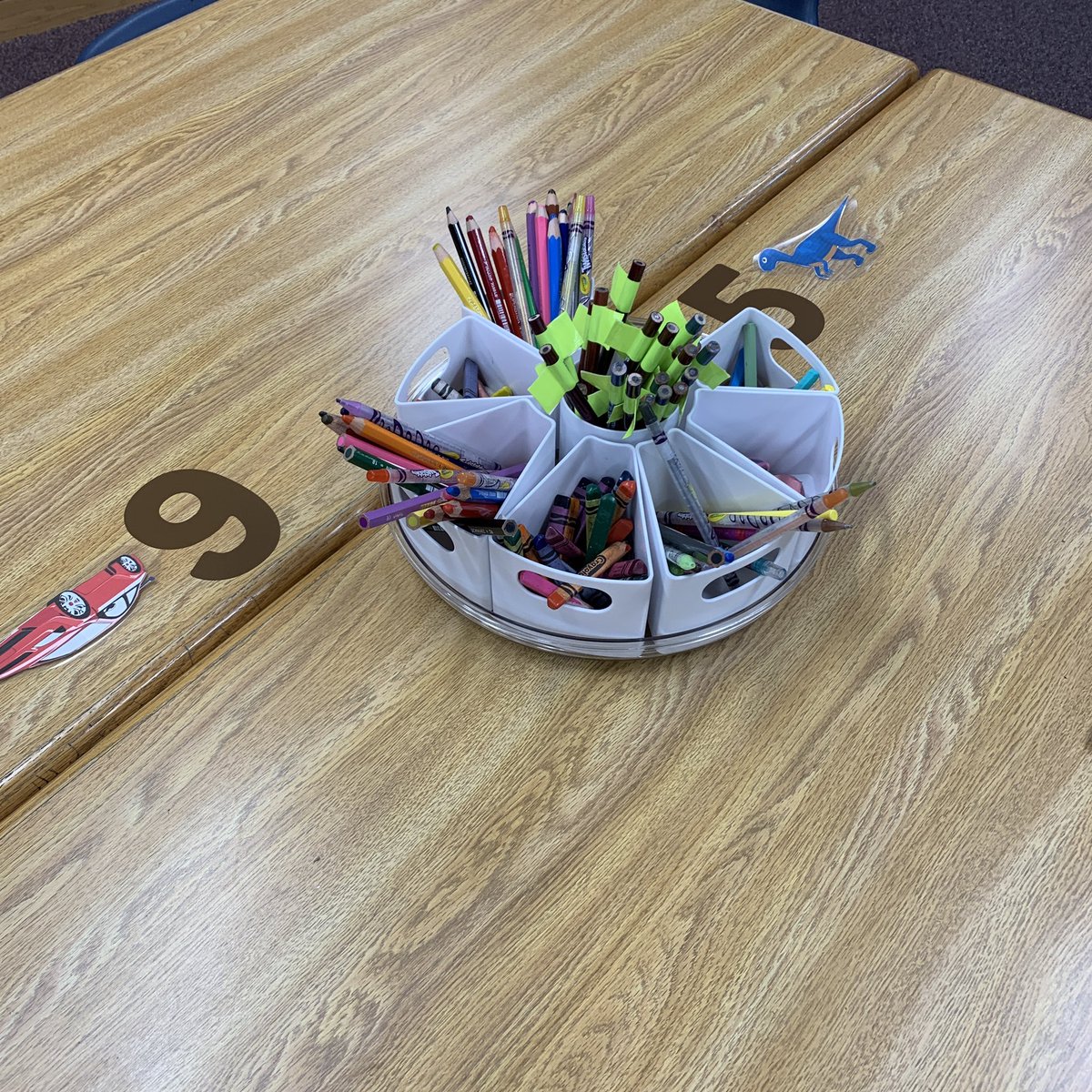 carolynvibbert's tweet image. Another small space finished! Lazy susans with removable supplies so I can put out only what is needed. Labeled tables to facilitate organized seating. I used symbols from popular nonfiction topics. #PWCSLibraries