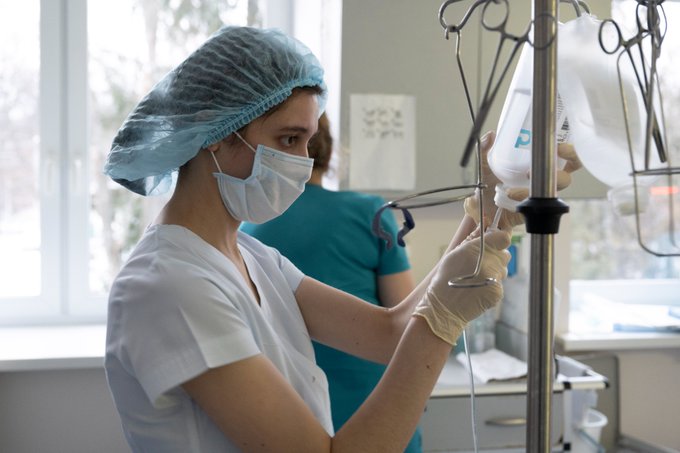 A nurse attending to a patient. ©WHO/Christopher Black